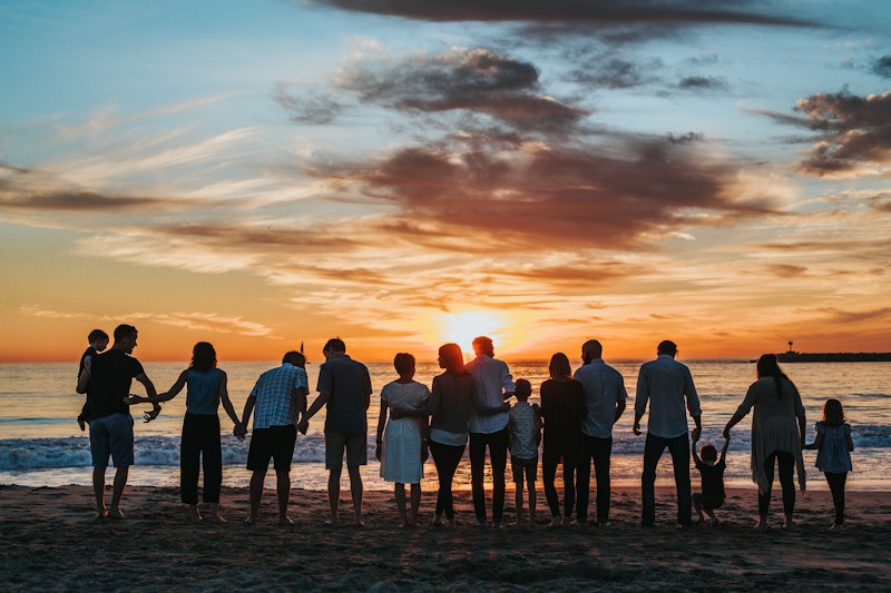 Family silhouette on the beach featured in our holiday packages
