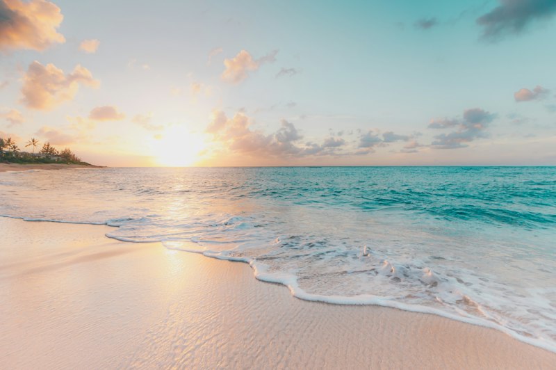 Peaceful sunset beach scenery on a seasonal shared trip holiday