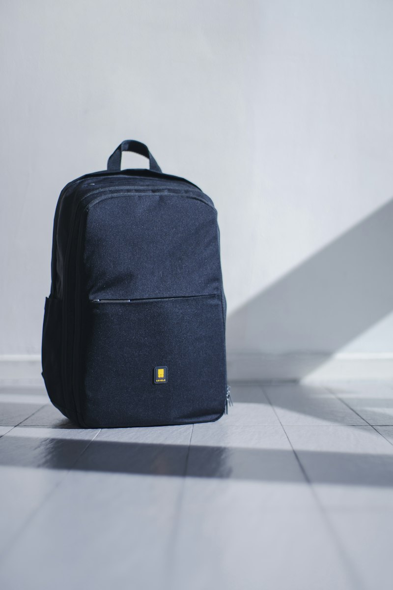 Traveler with a daypack backpack on a nature trail